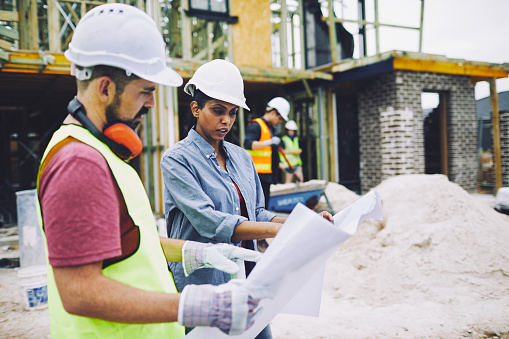 construction workers planning the mission